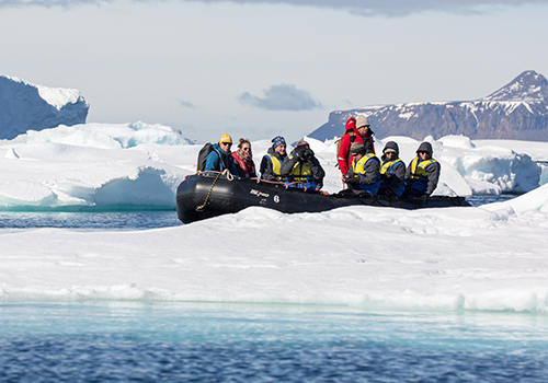 Zodiac cruising, Antarctica by Michael Baynes